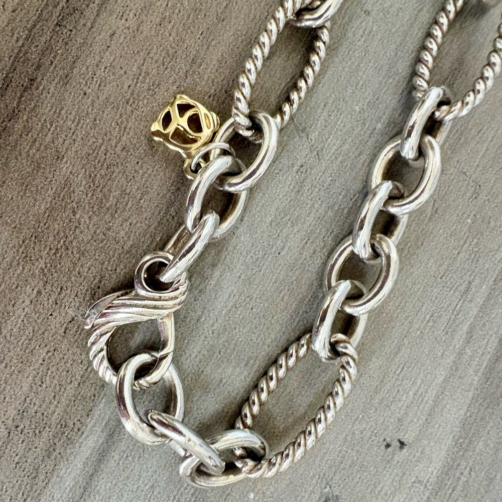 David Yurman 7.5 inch sterling silver and 18k gold Figaro link bracelet.